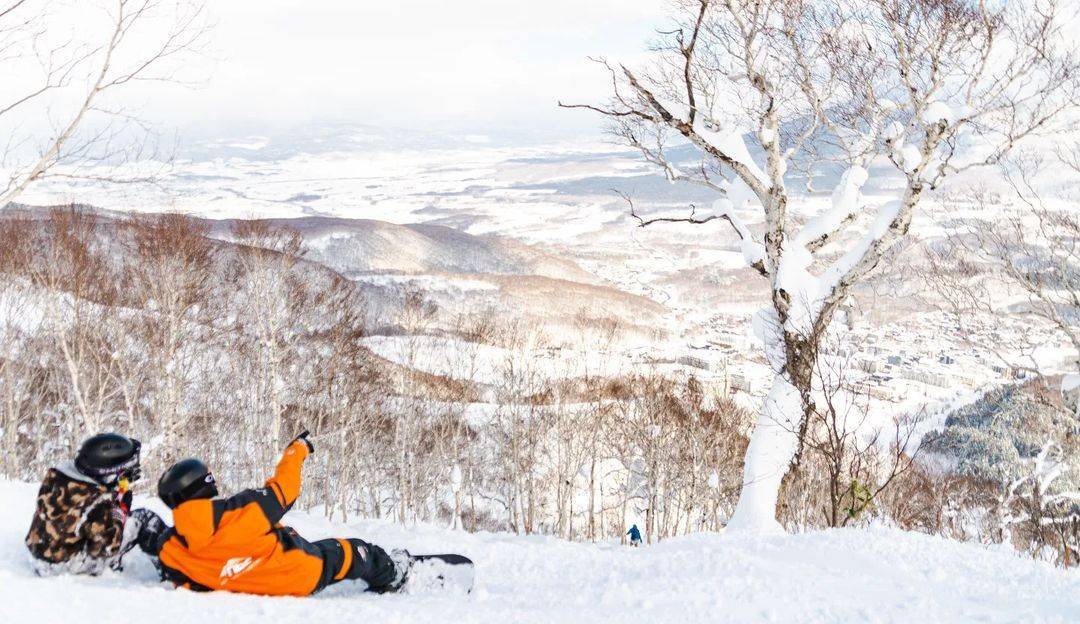 Resting during a snowboard lesson